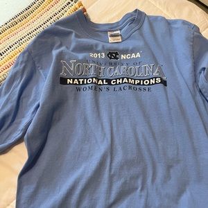 a blue NC womens lacrosse long sleeve shirt